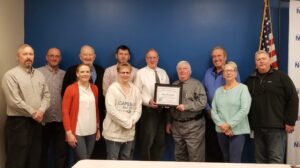 Group photo of Mike Mrozinski, Chris Chapman, Kate McMahon, Victor Rodite, Mary Liz Donato, Ted Ritsick, Peter Wulfhorst, Steve Pitoniak, Harry Lindsay, Cindy Campbell, Don King