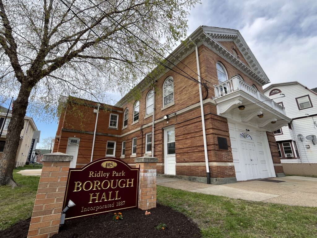 Brick Building with burgundy "Ridley Park Borough Hall" sign in front