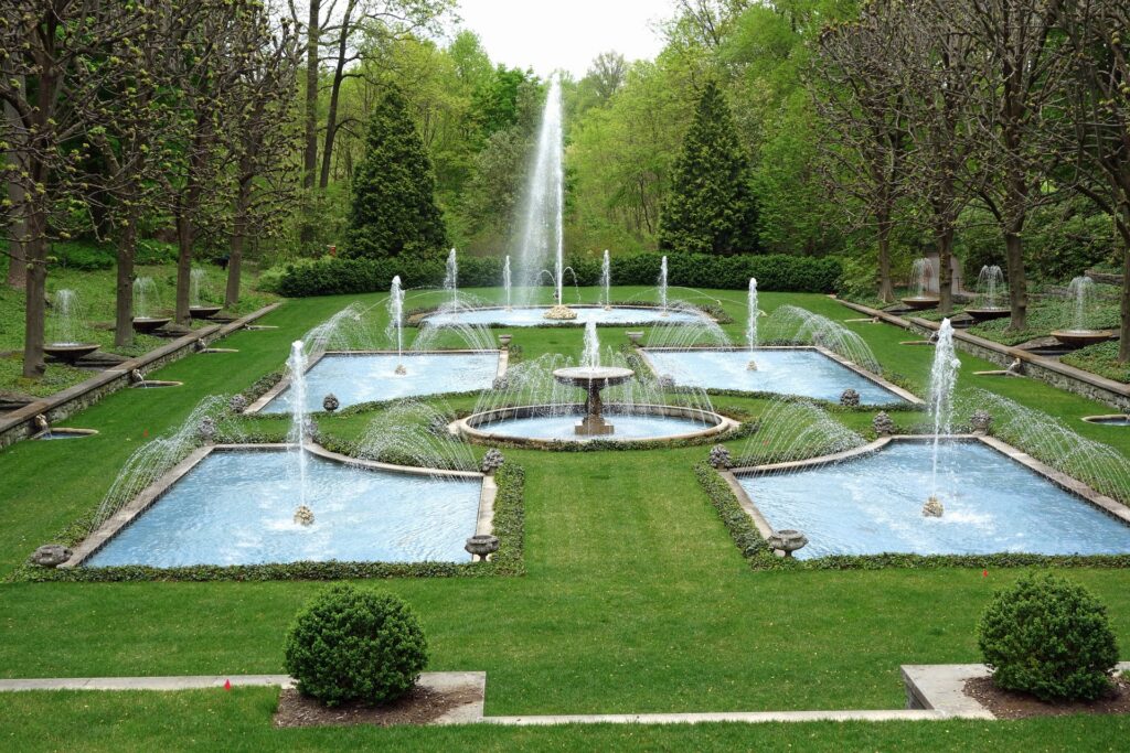 Looking over a garden with several fountains